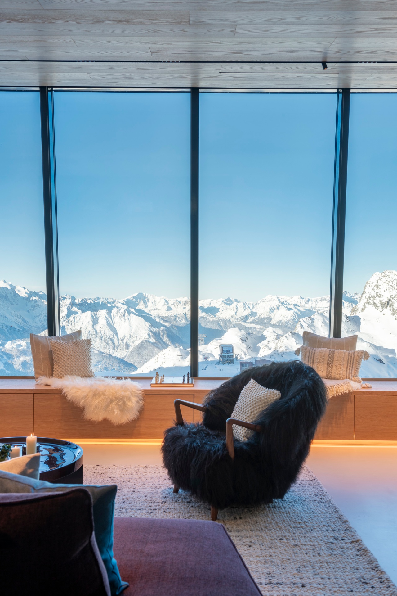 Bright interior of Cabane Tortin with panoramic alpine views